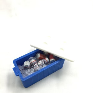 May include: A blue cooler with a white lid, filled with miniature cans of beer and ice cubes.