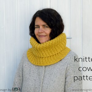 May include: A woman wearing a mustard yellow knitted cowl neck scarf. The text "knitted cowl pattern" is written in black on a white background below the woman. The text "crochet design by Bori" is written in black on a white background below the woman.