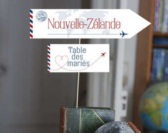 Personalized travel destination table marker on world map background