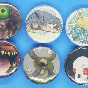 May include: Six round, colorful buttons with different monster illustrations. Each button features a different monster with a unique design and color scheme. The buttons are perfect for adding a touch of whimsy to any project.
