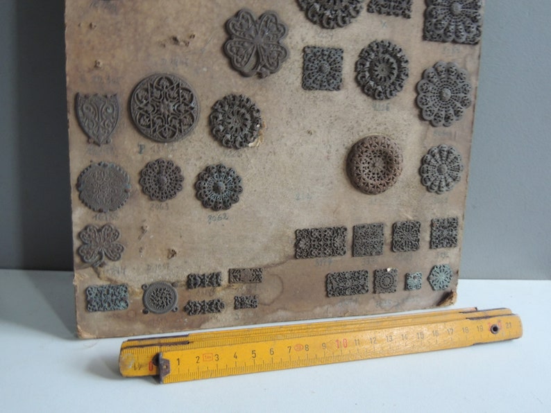 Antique hardware store brass ornaments items plate 19th century embellishments trim furniture or jewelry vintage decoration