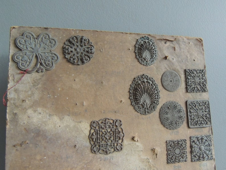 Antique hardware store brass ornaments items plate 19th century embellishments trim furniture or jewelry vintage decoration
