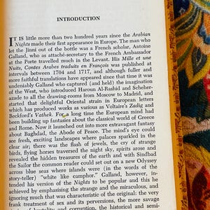 May include: Open book with the title "INTRODUCTION" at the top of the page. The text describes the history of the Arabian Nights. The book has yellowed pages and a decorative gold border.