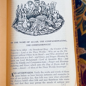 May include: Open book page with text and an illustration. The illustration is a detailed black and white drawing of figures, animals, and objects. The text includes the phrase "IN THE NAME OF ALLAH, THE COMPASSIONATE!"
