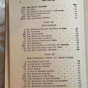 May include: A black and white book with the title "CONTENTS" printed on the cover. The book lists the chapters of a novel with page numbers.
