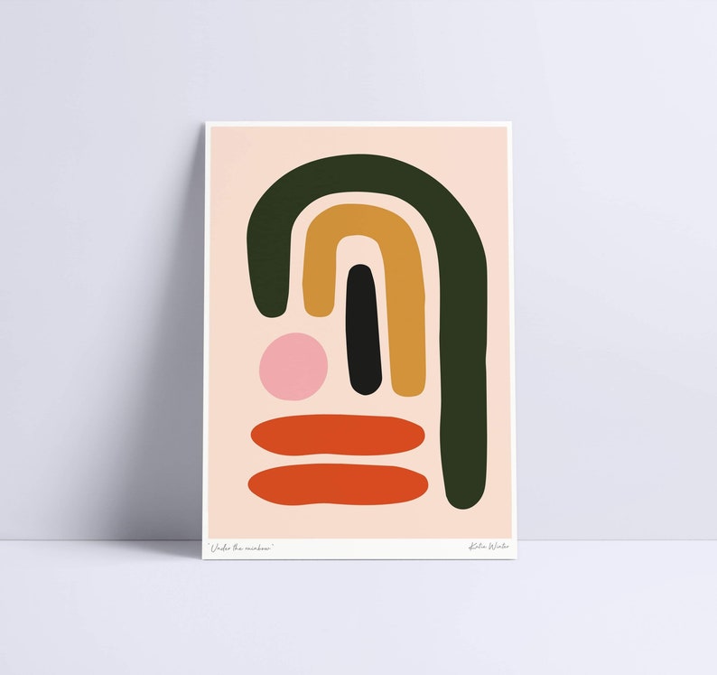 May include: Abstract art print featuring a composition of colorful shapes. The artwork includes a dark green arch, a mustard-yellow arch, a black vertical rectangle, a pink circle, and two orange horizontal shapes. The background is a light peach color. The text "Under the rainbow" is at the bottom.