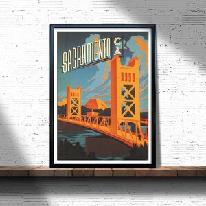 May include: A vintage travel poster featuring a stylised illustration of the Tower Bridge in Sacramento, California. The poster is in a retro style with a blue, orange and yellow colour scheme. The text "Sacramento CA" is displayed at the top of the poster.