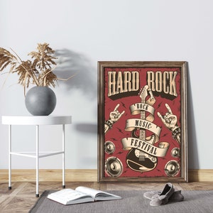May include: A vintage-style poster with the text "Hard Rock" in a bold font. The poster features a red background with a black electric guitar, a white ribbon with the text "Rock Music Festival", and two hands making the rock and roll hand gesture.