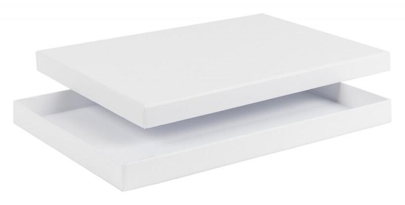 May include: A white rectangular box with a separate lid, slightly ajar. The box and lid are both a bright white color, suggesting a clean and minimalist design. The box is empty, ready for use.