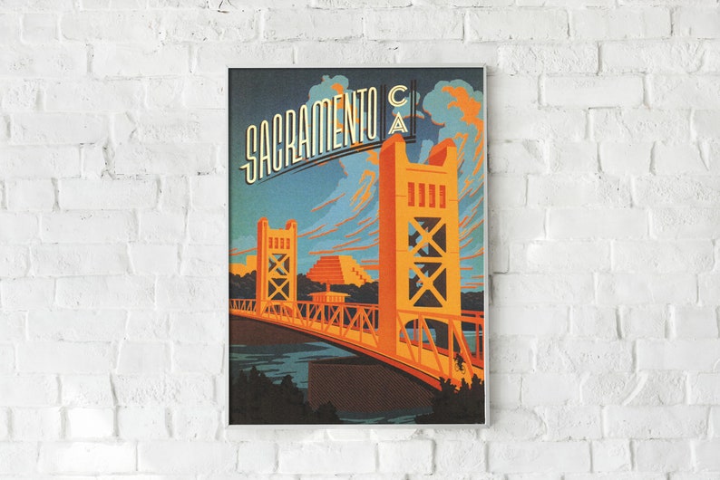 May include: A vintage travel poster featuring a stylised illustration of the Tower Bridge in Sacramento, California. The poster is in a retro style with a blue, orange and yellow colour scheme. The text "Sacramento CA" is displayed at the top of the poster.