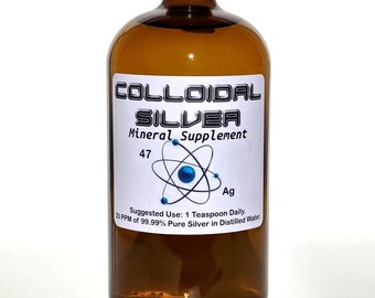 May include: A brown glass bottle with a green lid, labeled "COLLOIDAL SILVER Mineral Supplement 47 Ag 20 PPM of 99.99% Pure Silver in Distilled Water Suggested Use: 1 Teaspoon Daily."