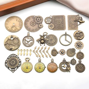 May include: A selection of antique bronze clock charms and components. The collection includes clock faces, gears, pocket watches, and decorative elements such as a bee and a rabbit. Roman numerals and clock hands are visible on the clock faces.