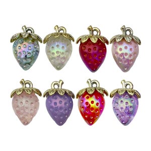 May include: Eight assorted colour strawberry charms with gold accents. The charms are made of glass and have an iridescent finish.