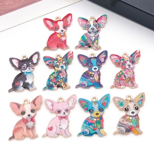 May include: A collection of colorful Chihuahua dog charms with gold-colored loops for jewelry making. The charms feature various designs, including floral patterns, geometric shapes, and solid colors like red, pink, and blue.