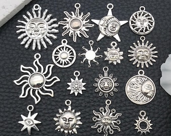 May include: A collection of silver-toned sun and moon charms. The charms vary in size and design, featuring smiling sun faces, starburst rays, and crescent moon details. These charms are ideal for jewelry making or craft projects.