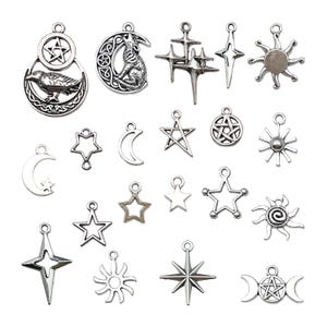 May include: A collection of silver charm pendants featuring various symbols, including stars, moons, suns, and pentagrams. The charms are perfect for jewellery making or adding a touch of whimsy to crafts.