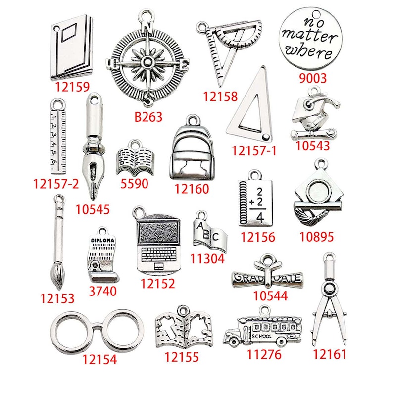 May include: A collection of silver charm pendants with various school-themed designs, including a compass, a ruler, a graduation cap, a book, a pencil, a diploma, a laptop, a school bus, and a pair of glasses. The charms are all silver and have a vintage look.