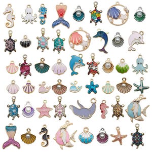 May include: Assortment of colourful enamel charms featuring sea life and ocean-themed designs. The charms include seahorses, mermaids, starfish, seashells, turtles, dolphins, whales, and octopuses. The charms are perfect for jewellery making, scrapbooking, and other craft projects.