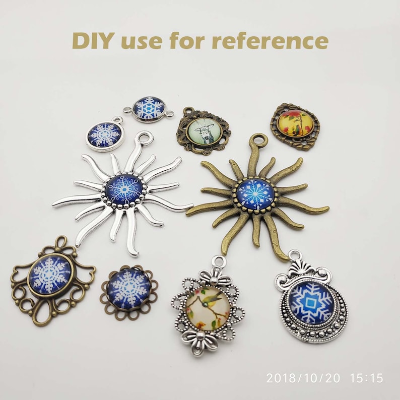 May include: Assortment of silver and bronze metal charms with blue and white snowflake designs. The charms are perfect for DIY jewelry making projects.