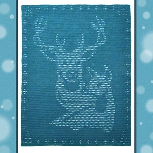 May include: A teal blue crochet blanket featuring a white deer design. The deer is facing to the right and has large antlers.