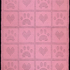 May include: A pink crochet blanket with a repeating pattern of small black circles. The blanket is made up of five rows of five squares.