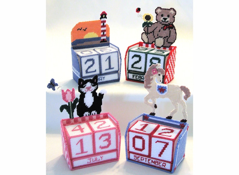 Plastic Canvas Perpetual Calendars featuring a Lighthouse Scene, Teddy Bear with Sunflower and Ladybug, Tuxedo Kitty with Tulip and Butterfly and Horse.