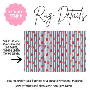 May include: A rectangular rug featuring a pattern of red apples over vertical blue and white stripes. Text reads: Keen Bee Studio, Rug Details, our rugs are sewn around the edges, making them more sturdy, 100% polyester base, spot clean only.