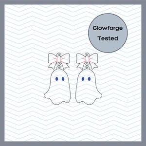 May include: A pair of ghost-shaped pendants featuring a bow at the top and two blue oval eyes. The design includes a circular hole for hanging. A circular badge in the upper right corner contains the text Glowforge Tested in black lettering.