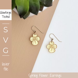May include: A pair of yellow flower-shaped earrings with a gold outline. The earrings are made of wood and have a simple, elegant design.  Glowforge Tested. SVG laser file.
