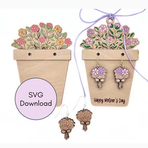 May include: Two light-coloured wooden flower pot displays with floral cutouts. One display features purple flowers and the text Happy Mother's Day with hanging bouquet earrings. A purple circle with the text SVG Download is visible on the left.