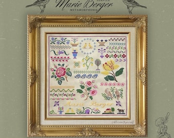 Pode incluir: Um sampler de ponto cruz emoldurado com um desenho floral e o texto "Marie Berger" em fio amarelo. O sampler está em uma moldura dourada e tem um fundo branco. O texto "Mille Fleur" está escrito em itálico na parte inferior da imagem.