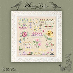 May include: A white framed cross-stitch sampler with a beige background and colorful floral designs. The sampler includes the text "Marie Berger" and "Victorian Sampler".