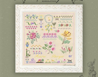 Könnte beinhalten: Ein weiß gerahmter Kreuzstich-Sampler mit beigefarbenem Hintergrund und bunten floralen Designs. Der Sampler enthält den Text "Marie Berger" und "Victorian Sampler".