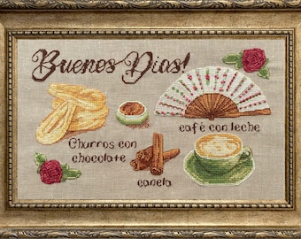 Puede incluir: Un diseño de bordado de punto de cruz que representa una escena de desayuno con el texto "Buenos Dias!" en español. El diseño incluye churros con chocolate, una taza de café con leche, palitos de canela y un abanico.