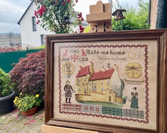 May include: A framed cross-stitch embroidery with a house, a dragonfly, and the text "Take me home, you are my home".
