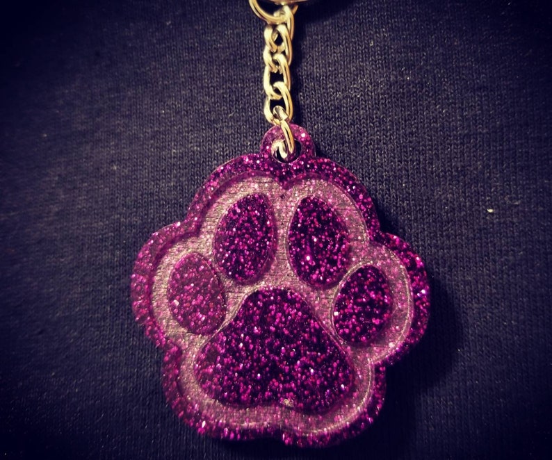 Carry the love for your pet with your keys! Glitter Paw Keychain Many color options
