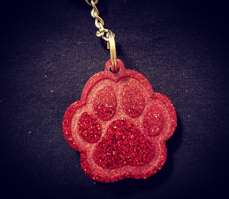 Carry the love for your pet with your keys! Glitter Paw Keychain Many color options