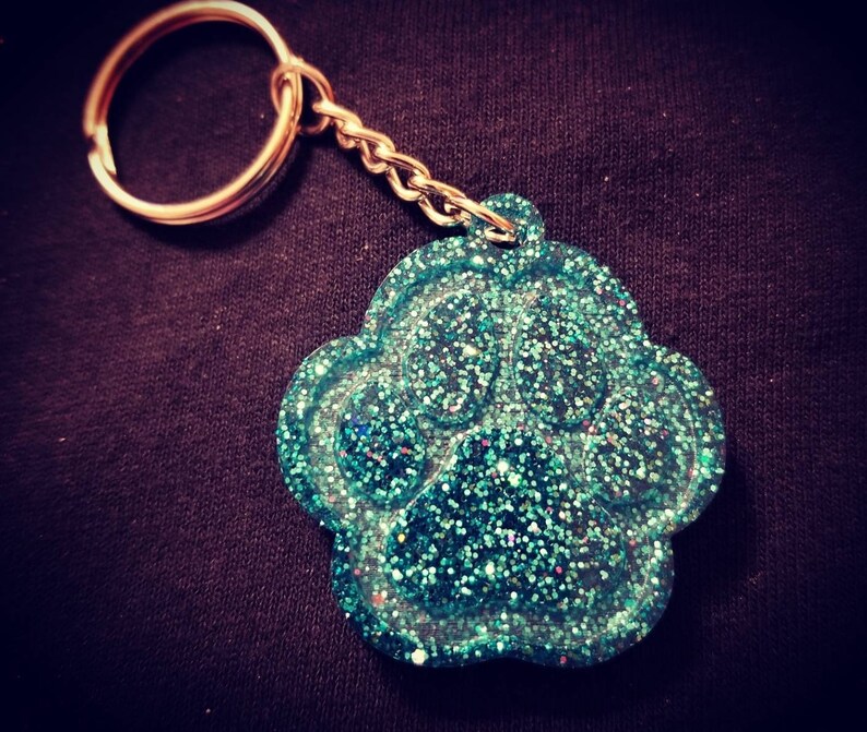 Carry the love for your pet with your keys! Glitter Paw Keychain Many color options