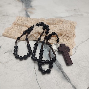 Religious   rosary with wooden beads and wooden cross crucifix