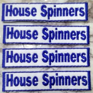 May include: Four white rectangular patches with blue embroidered text that reads "House Spinners".