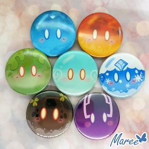 Puede incluir: Conjunto de seis pines redondos con caras de dibujos animados con diferentes colores y expresiones. Los pines son azules, naranjas, verdes, azules claros, azules y morados.