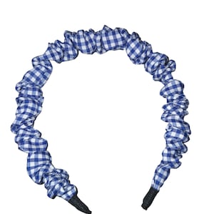 May include: Blue and white gingham headband with a black elastic band.