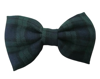 May include: A green and black tartan bow tie.
