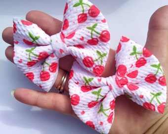 Set of two  3 inch cherry themed pigtail hair bows available on bobbles or clips