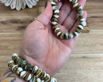 Eye of Shiva-schelparmband: operculum-slak, boze oog-amulet