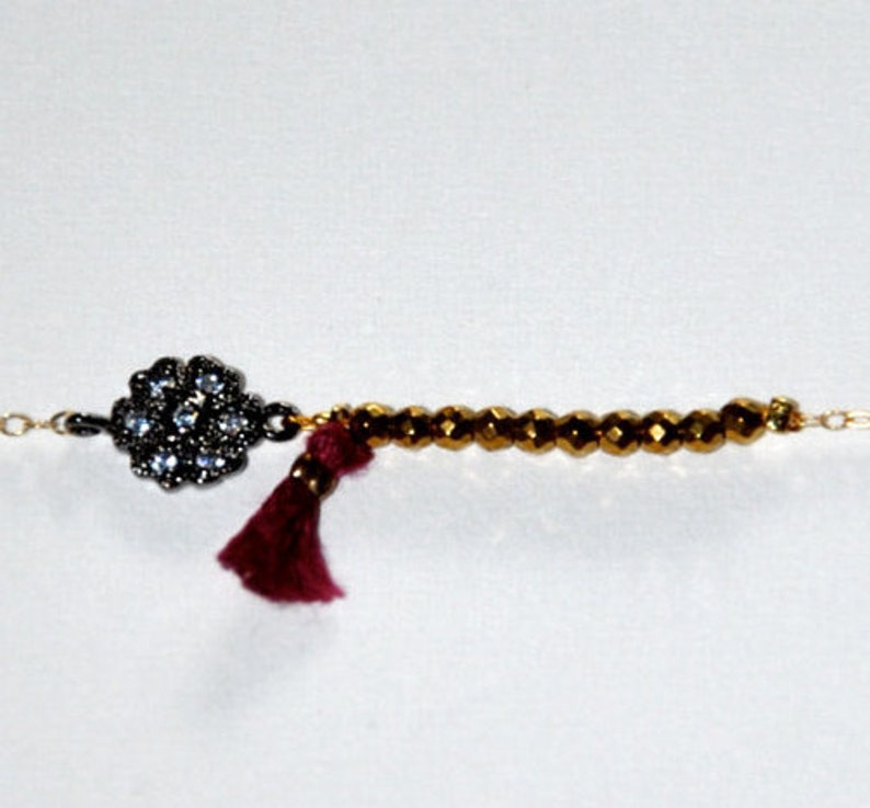 Gold-plated bracelet with micro Hematite, silk tassel and silver aged flower paved zircons image 2