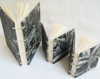 Small handmade notebooks, set of three blank books with black and white monoprint covers, unlined paper