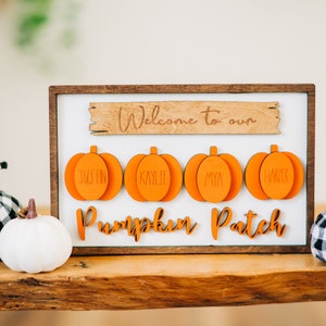 May include: Wooden sign with the text "Welcome to our Pumpkin Patch" and four orange pumpkin cutouts with the names Justin, Kaylee, Mya, and Walker.