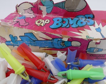 vintage 1970s toys cap rockets and parachute jumper 