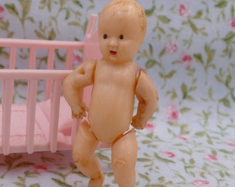 Photographie d'un bébé avec poupée années 50 - Collection